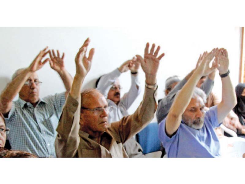twenty patients suffering from parkinson s disease emulated yoga poses shown to them on a video during a group supporting meeting photo aysha saleem express
