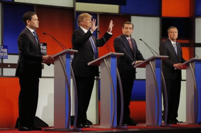 republican u s presidential candidate donald trump shows off the size of his hands as rivals marco rubio l ted cruz 2nd r and john kasich r look on at the start of the u s republican presidential candidates debate in detroit michigan march 3 2016 photo reuters