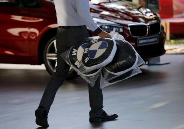 a dealer carries bmw 039 s promotional cushions at a dealer shop in beijing china september 11 2015 reuters a dealer carries bmw 039 s promotional cushions at a dealer shop in beijing china september 11 2015 reuters