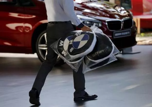 a dealer carries bmw 039 s promotional cushions at a dealer shop in beijing china september 11 2015 reuters a dealer carries bmw 039 s promotional cushions at a dealer shop in beijing china september 11 2015 reuters
