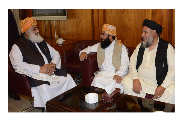 jui f chief exchanging views with deputy chairman senate maulana abdul ghafoor haideri at parliament house photo inp