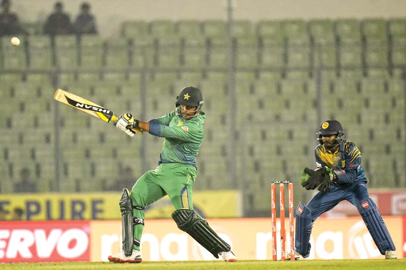 sharjeel khan plays a shot as wicketkeeper niroshan dickwella looks on photo afp