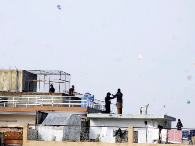 residents claim osama tahir fell to his death while evading police who saw him flying a kite photo nni