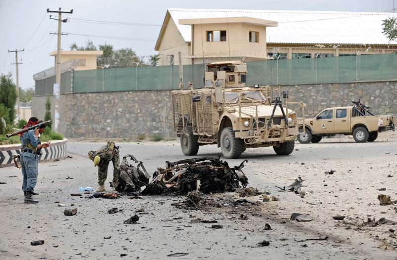 afghan soldiers next to the bombing site photo afp