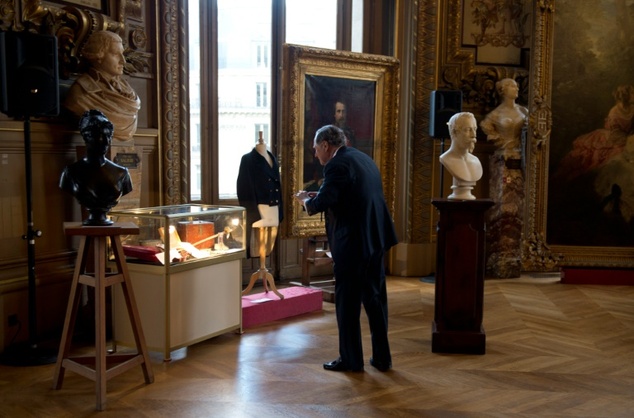 us billionaire and art collector christopher forbes takes a photo of some of the items of his private collection on napoleon iii set to be auctioned in march in paris on february 23 2016 photo afp