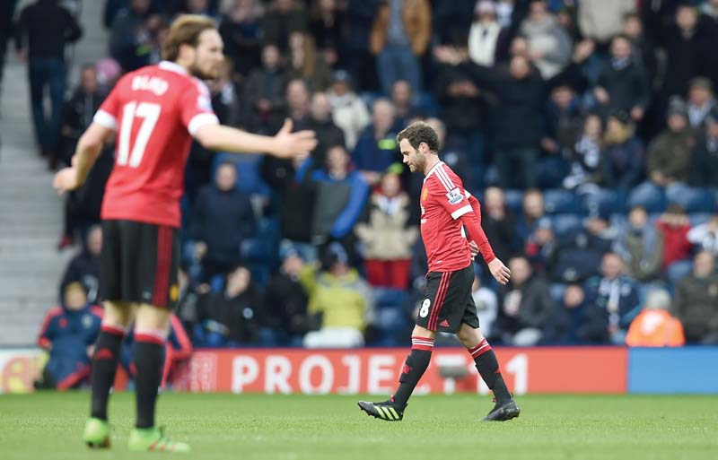 manchester united s spanish midfielder juan mata walks from the field of play after receiving his second yellow card of the game photo afp