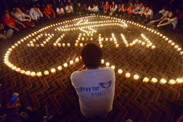 this file photo taken on april 08 2014 shows chinese relatives of passengers on the missing malaysia airlines flight mh370 taking part in a prayer service at the metro park hotel in beijing malaysia and australia said they remained quot hopeful quot of solving the mystery of flight mh370 as the second anniversary of the plane 039 s disappearance arrived on march 8 2016 with no end in sight for devastated families photo afp