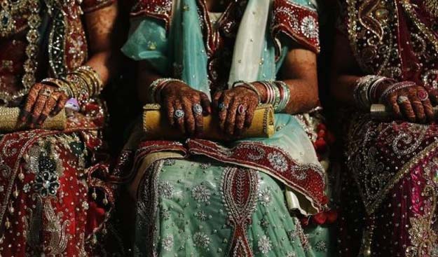 muslim brides wait for the start of their mass marriage ceremony in mumbai may 11 2014 photo reuters