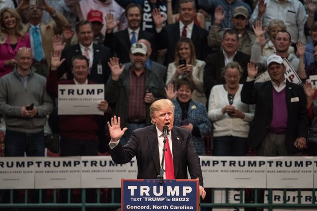 republican presidential candidate donald trump encourages supporters to pledge their votes at a campaign rally march 7 2016 in concord north carolina photo afp