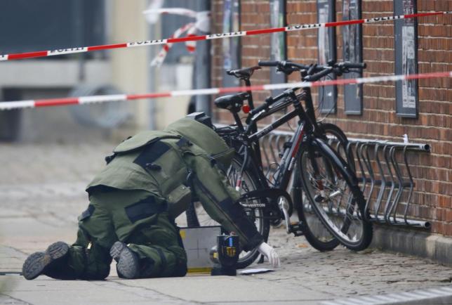 a bomb disposal expert investigates an unattended package in copenhagen denmark on february 17 2015 photo reuters