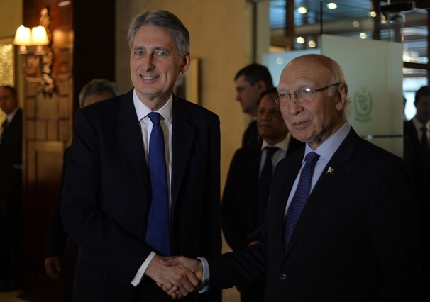 pakistan prime minister 039 s advisor on foreign affairs sartaj aziz r and british foreign secretary philip hammond l shake hands at a joint press conference in islamabad on march 8 2016 photo afp