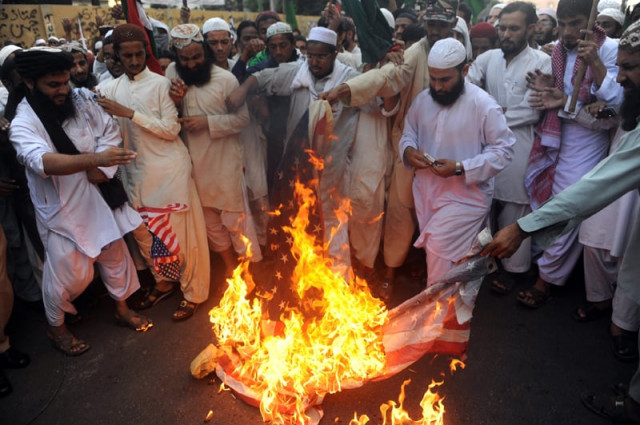 pakistani islamists burn us flags during a protest in karachi on december 2 2011 against the cross border nato air strike on pakistani troops photo afp pakistani islamists burn us flags during a protest in karachi on december 2 2011 against the cross border nato air strike on pakistani troops photo afp