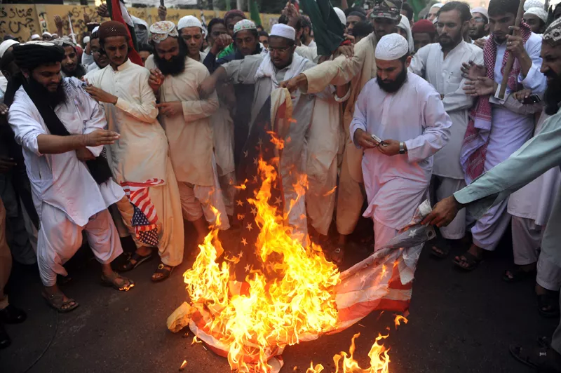 pakistani islamists burn us flags during a protest in karachi on december 2 2011 against the cross border nato air strike on pakistani troops photo afp pakistani islamists burn us flags during a protest in karachi on december 2 2011 against the cross border nato air strike on pakistani troops photo afp