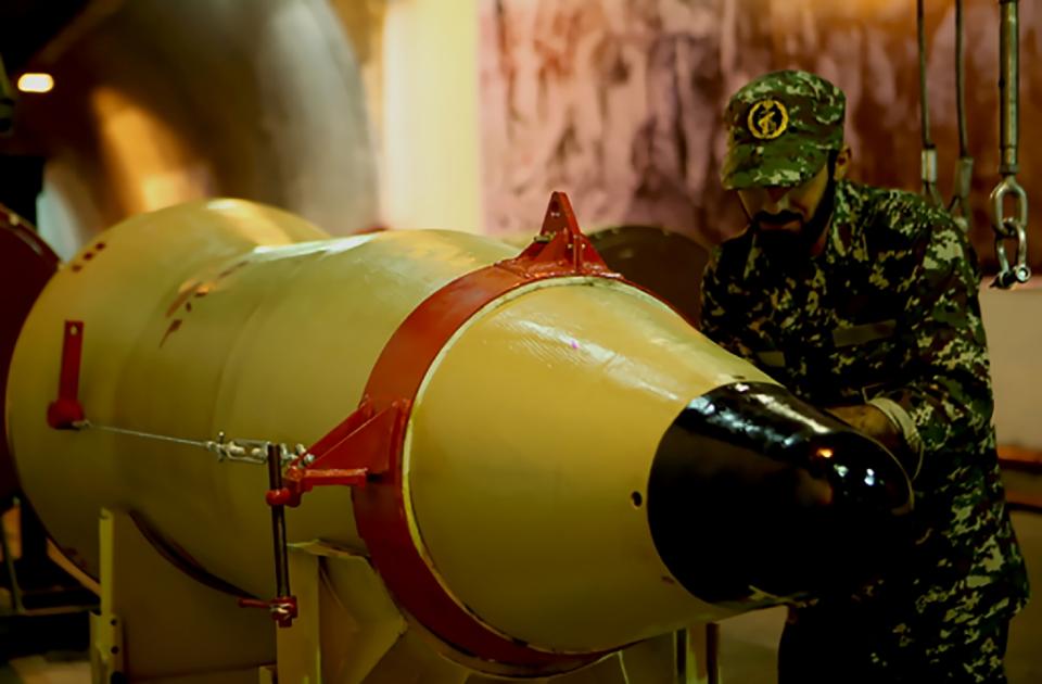 a member of the revolutionary guards inspects a missile at an undisclosed location in iran photo afp