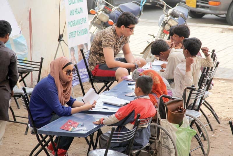 shireen and hassan teach street children at an empty plot near cafe clifton six days a week from 4 30pm to 6pm photo ayesha mir express