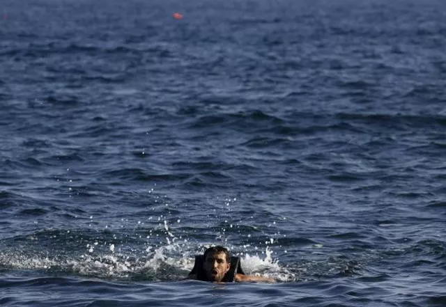 a man struggles as he approaches a beach on the greek island of lesbos after jumping from an overcrowded dinghy while crossing a part of the aegean sea from turkey september 17 2015 reuters a man struggles as he approaches a beach on the greek island of lesbos after jumping from an overcrowded dinghy while crossing a part of the aegean sea from turkey september 17 2015 reuters