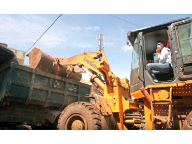 mqm s mayor nominee wasim akhtar drives a mechanised dumper in lines area during the cleanliness campaign that kicked off on thursday photo athar khan express mqm s mayor nominee wasim akhtar drives a mechanised dumper in lines area during the cleanliness campaign that kicked off on thursday photo athar khan express