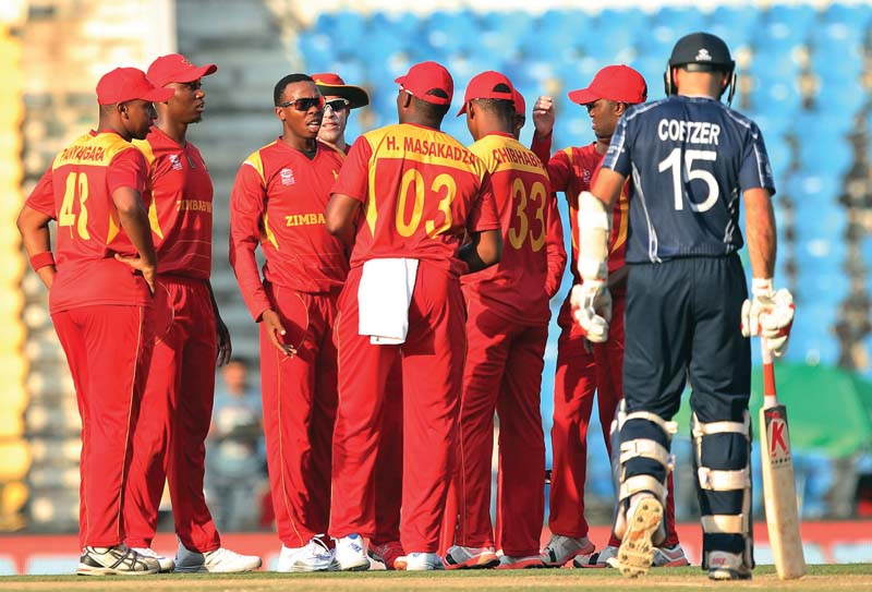 wellington claimed four wickets to guide zimbabwe to a nervy win over scotland in their group b world t20 encounter photo afp