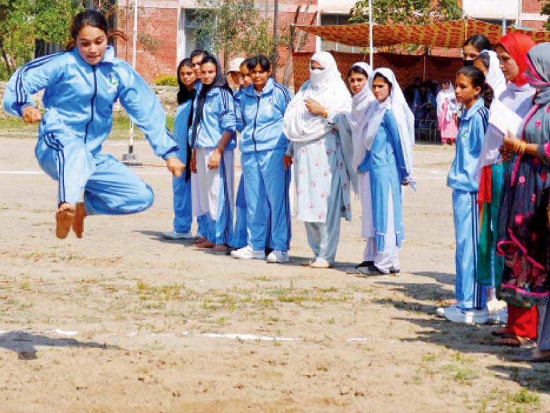 an athlete takes part in the long jump competition photo inp