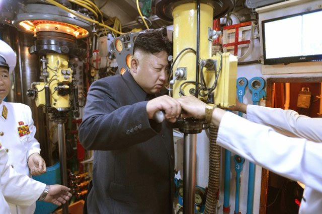 north korean leader kim jong un inspects a korean people 039 s army submarine at an undisclosed location photo afp