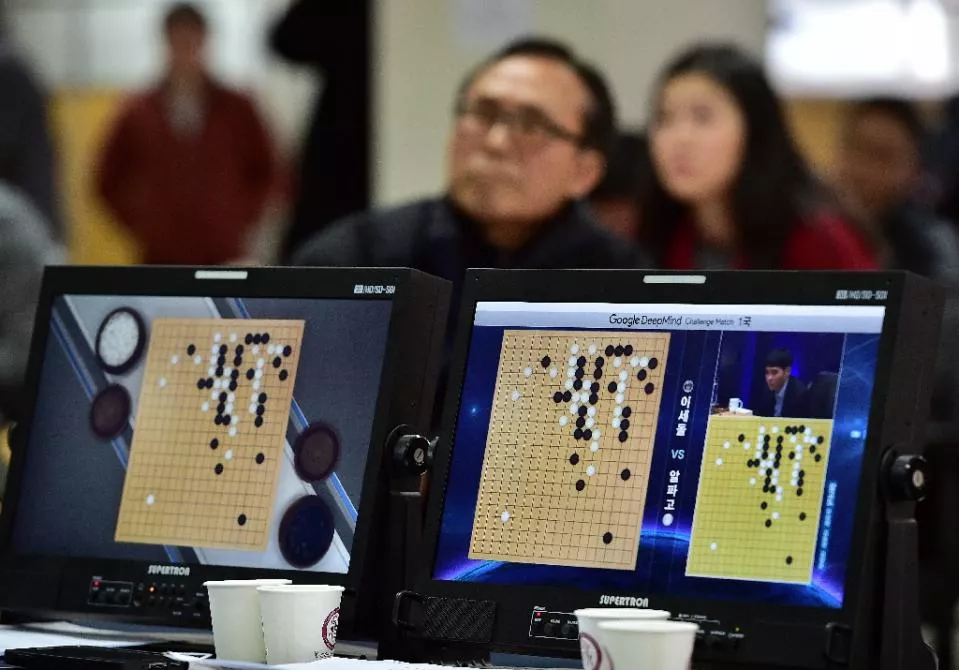go game fans watch a tv screen broadcasting live footage of the google deepmind challenge match at the korea baduk association in seoul on march 9 2016 photo afp go game fans watch a tv screen broadcasting live footage of the google deepmind challenge match at the korea baduk association in seoul on march 9 2016 photo afp