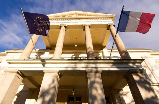 the french and european flags fly at the palais clam gallas in austrian capital vienna on november 11 2015 photo afp