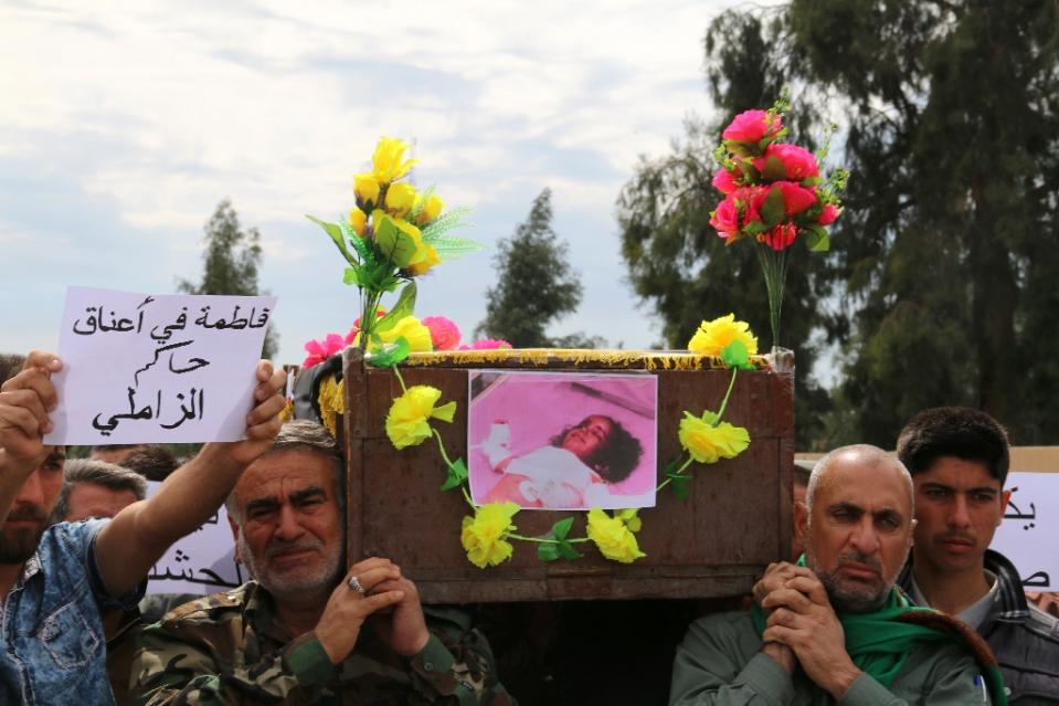 iraqis carry the coffin of a young girl who was killed following a chemical attack on taza a town on the outskirts of kirkuk on march 11 2016 photo afp