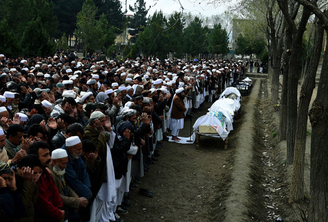 afghan mourners offer funeral prayers for members of a family who drowned trying to cross the aegean sea between turkey and greece during a funeral ceremony in kabul on march 12 2016 photo afp