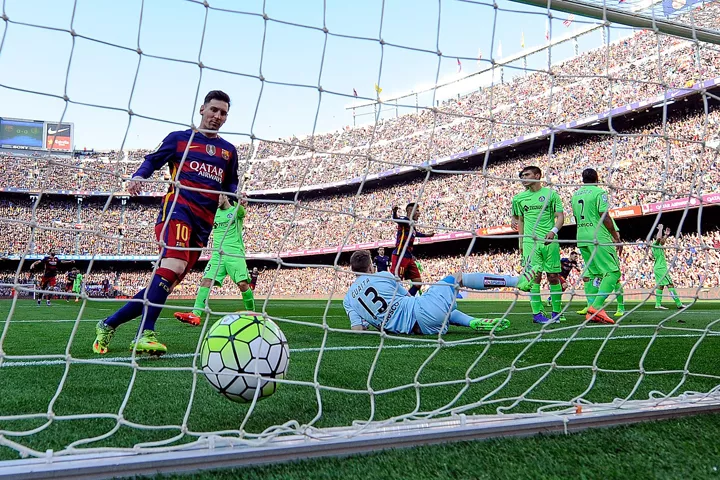 barcelona 039 s argentinian forward lionel messi l looks at the ball in getafe 039 s net after a goal during the spanish league football match fc barcelona vs getafe cf at the camp nou stadium in barcelona on march 12 2016 photo afp barcelona 039 s argentinian forward lionel messi l looks at the ball in getafe 039 s net after a goal during the spanish league football match fc barcelona vs getafe cf at the camp nou stadium in barcelona on march 12 2016 photo afp