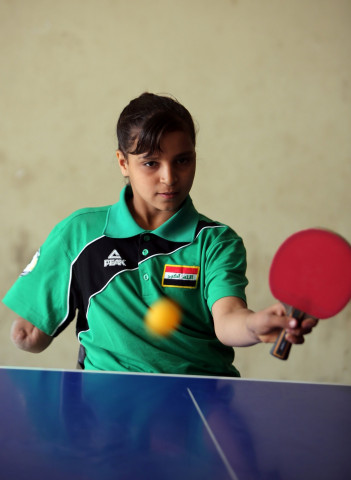 twelve year old disabled iraqi nejla imad plays table tennis in baquba a city northeast of baghdad on february 20 2016 photo afp twelve year old disabled iraqi nejla imad plays table tennis in baquba a city northeast of baghdad on february 20 2016 photo afp