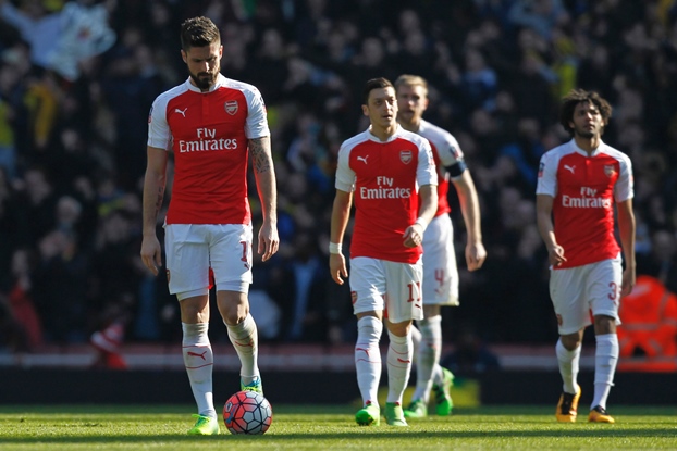 arsenal players react after conceding the opening goal during the fa cup quarter final match against watford at the emirates stadium in london on march 13 2016 photo afp