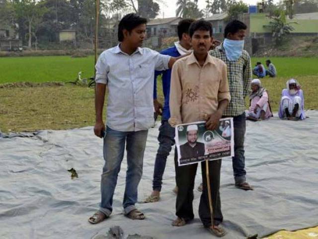 supporters of the all india united democratic front aiudf attend an election campaign rally in jaleswar village in assam india march 3 2016 photo reuters