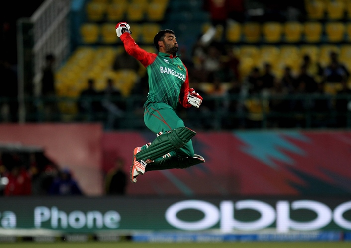 tamim iqbal reacts after scoring a century against oman in dharamsala on march 13 2016 photo afp