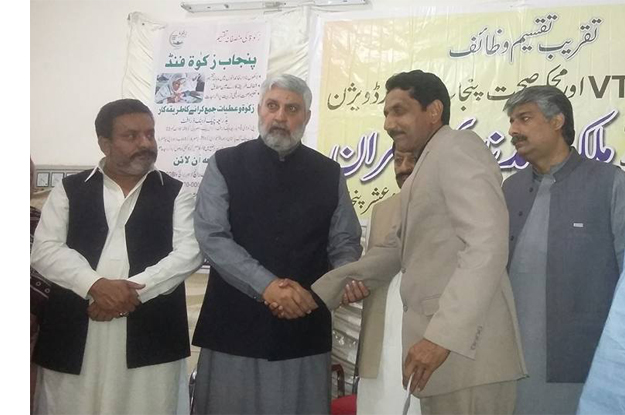 minister for zakat and ashur malik nadeem kamran distributing cheques worth more than rs156 5 million among patients and students of vocational trainings institutions photo facebook