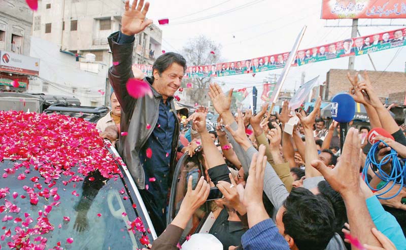 imran khan waves to the crowd before his address at jalapu peerwala in multan ahead of by elections in the constituency photo inp