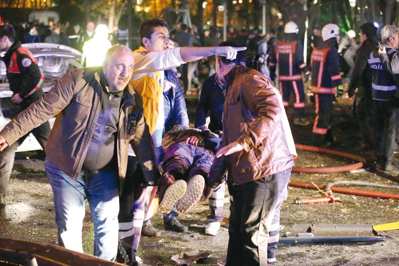 rescuers carry a victim on a stretcher after a blast in ankara photo afp