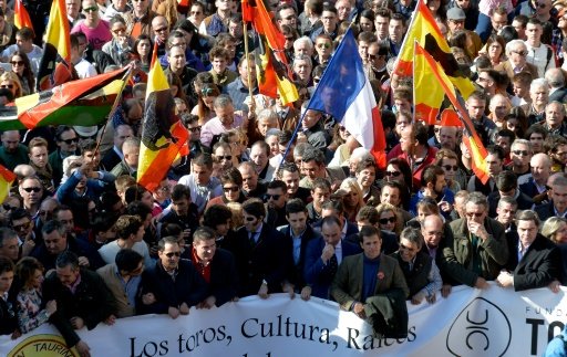 pro bullfighting supporters wave flags as they demonstrate during the fallas festival in valencia on march 13 2016 photo afp