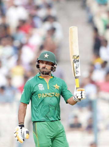 hafeez raises his bat after his half century against sri lanka at the eden gardens photo afp hafeez raises his bat after his half century against sri lanka at the eden gardens photo afp
