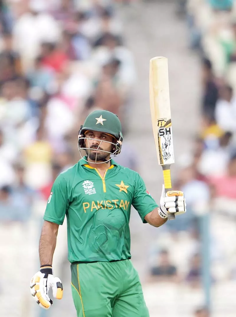 hafeez raises his bat after his half century against sri lanka at the eden gardens photo afp hafeez raises his bat after his half century against sri lanka at the eden gardens photo afp