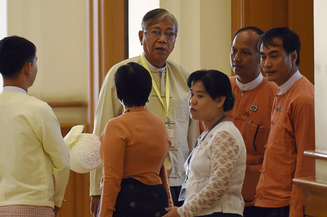 htin kyaw c trusted confidante and anointed proxy of myanmar democracy icon aung san suu kyi arrives with his wife member of parliament su su lwin 2nd l at the parliament on march 15 2016 before the start of voting to select a president photo afp