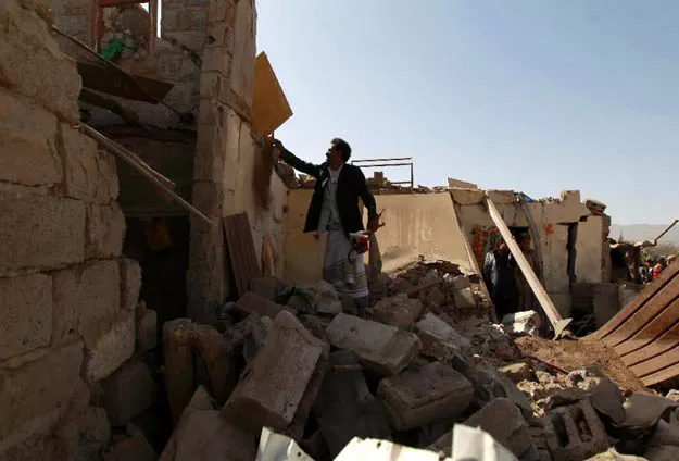 a yemeni man checks the ruins of buildings destroyed in an air strike by the saudi led coalition on february 25 2016 in the capital sanaa photo afp a yemeni man checks the ruins of buildings destroyed in an air strike by the saudi led coalition on february 25 2016 in the capital sanaa photo afp