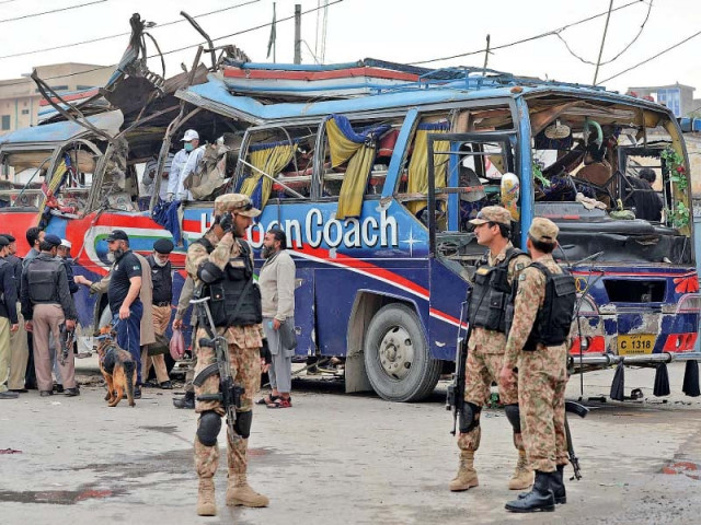 security officials inspect the damaged bus after the blast photo afp security officials inspect the damaged bus after the blast photo afp