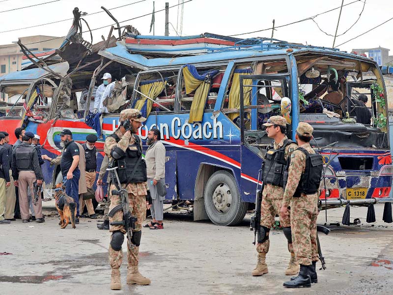 security officials inspect the damaged bus after the blast photo afp