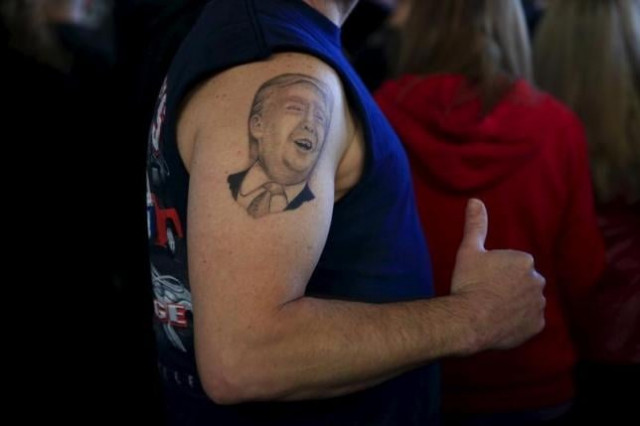 a supporter shows his tattoo before u s republican presidential candidate donald trump 039 s campaign rally at winner aviation in youngstown ohio march 14 2016 photo reuters a supporter shows his tattoo before u s republican presidential candidate donald trump 039 s campaign rally at winner aviation in youngstown ohio march 14 2016 photo reuters