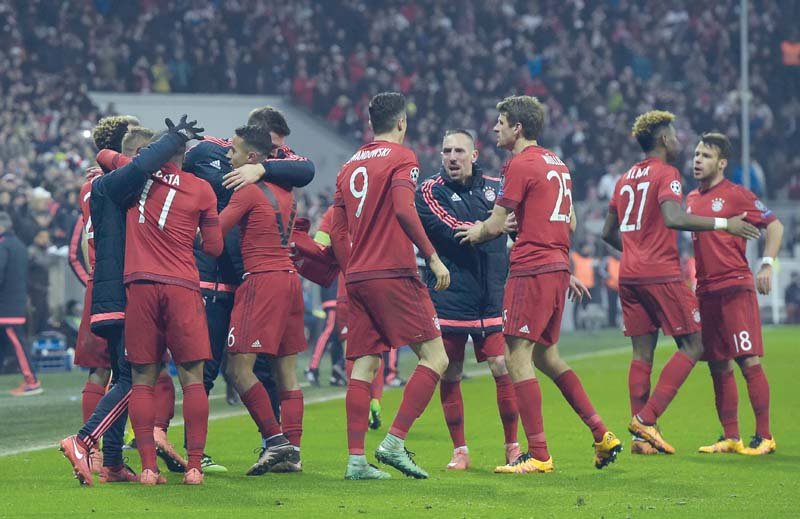 bayern players celebrate spanish midfielder thiago alcantara s hidden goal in extra time which made the score 3 2 on the night and 5 4 on aggregate in bayern s favour kingsley coman made it 4 2 soon after photo afp