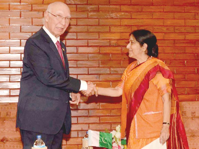 sartaj aziz greets sushma swaraj before their meeting in pokhara photo afp