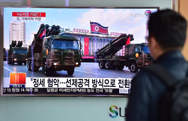 a man in seoul watches a news report on north korean missiles on parade in pyongyang on march 4 2016 photo afp