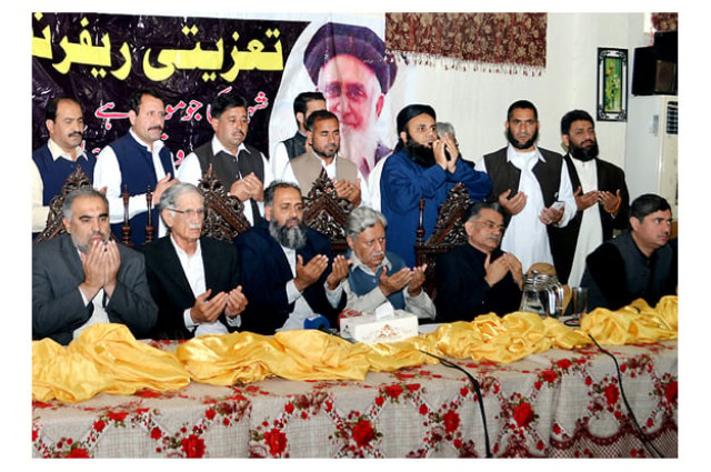 chief minister pervez khattak and other praying for the eternal peace of haji haleem jan shaheed during condolence reference photo nni