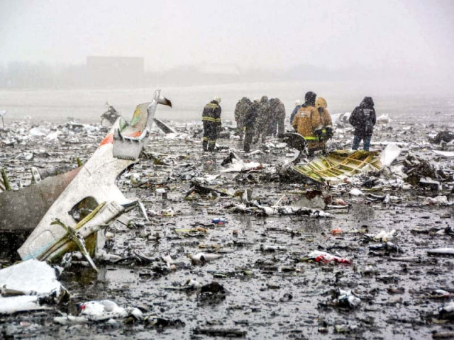 a handout picture shows russian rescuers working at the crash site photo afp a handout picture shows russian rescuers working at the crash site photo afp