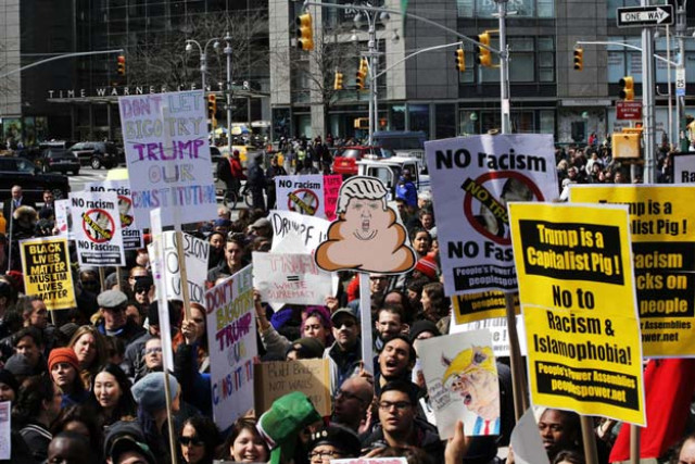 new york ny march 19 people take part in a protest against republican presidential candidate donald trump on march 19 2016 in new york city people protest against trump 039 s policies which threaten the immigration system and many of the latino black lgbt muslim and other communities photo afp new york ny march 19 people take part in a protest against republican presidential candidate donald trump on march 19 2016 in new york city people protest against trump 039 s policies which threaten the immigration system and many of the latino black lgbt muslim and other communities photo afp